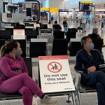 What happens if a person tests positive for covid before travelling